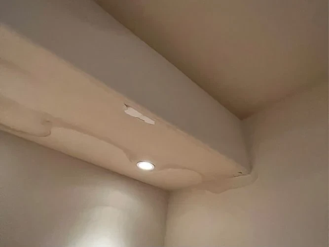Before: water-stained soffit with peeling paint