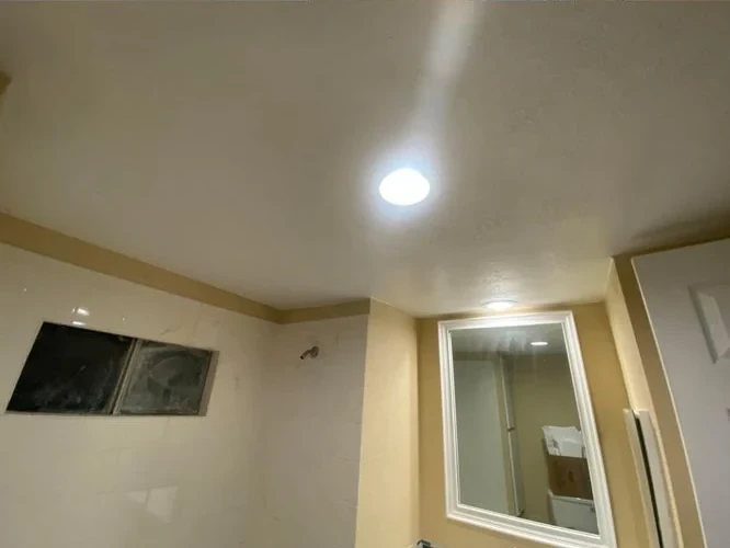 After: repaired ceiling with recessed lighting